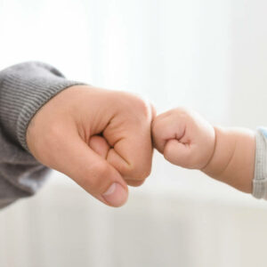 parentage paternity baby fist bump